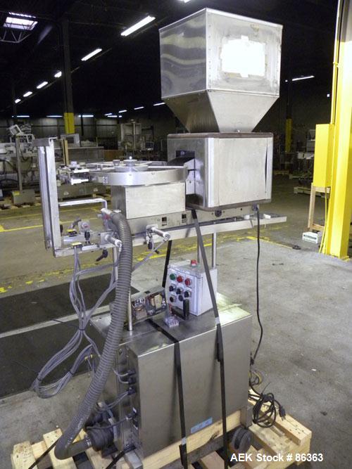 Used Deitz Company Versacount Tablet/Capsule Counter/Bottle Filler, Model FF 714R. 16" diameter turntable, feed hopper with vibratory feeder. Approximately 2400 tablets per minute. Includes a model A...