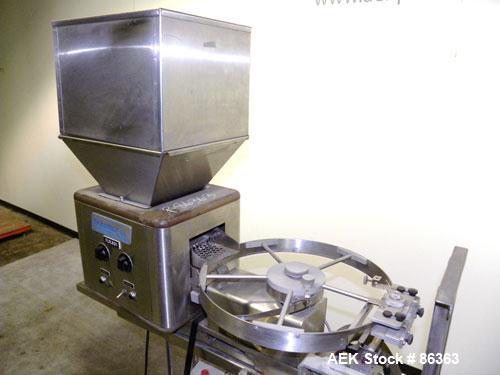 Used Deitz Company Versacount Tablet/Capsule Counter/Bottle Filler, Model FF 714R. 16" diameter turntable, feed hopper with vibratory feeder. Approximately 2400 tablets per minute. Includes a model A...