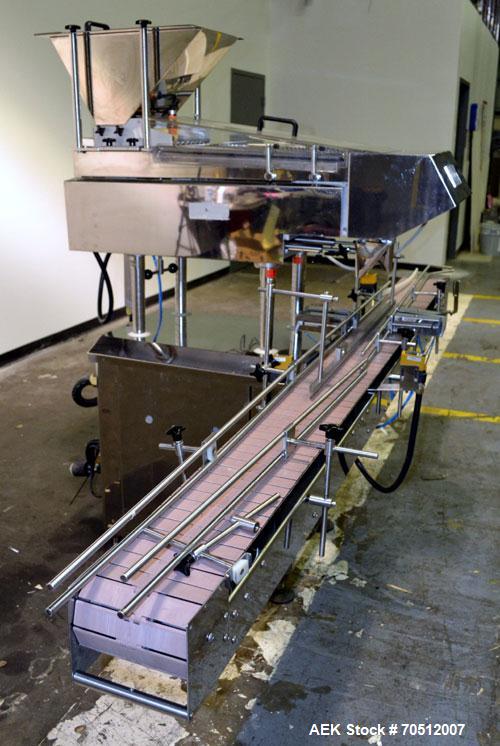 Used King Model TC8 Electronic Tablet Counter. Capable of speeds up to 60 bottles per minute depending on count and container size. Has two trays with 8 channels, pin indexing system and conveyor. Du...