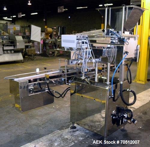 Used King Model TC8 Electronic Tablet Counter. Capable of speeds up to 60 bottles per minute depending on count and container size. Has two trays with 8 channels, pin indexing system and conveyor. Du...