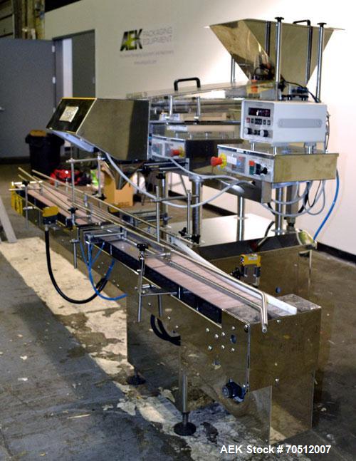 Used King Model TC8 Electronic Tablet Counter. Capable of speeds up to 60 bottles per minute depending on count and container size. Has two trays with 8 channels, pin indexing system and conveyor. Du...