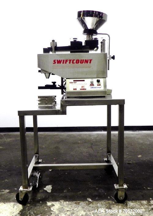 Used SwiftPack Model SwiftCount Electronic Tablet Counter. Designed to feed and count any size shape or quantity of tablets without change parts, in batches of 2-9999. Incorporates a similar micropro...