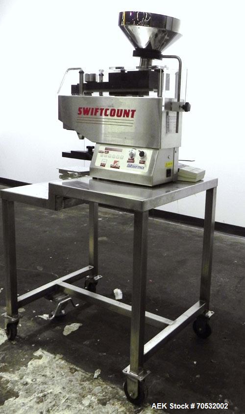 Used SwiftPack Model SwiftCount Electronic Tablet Counter. Designed to feed and count any size shape or quantity of tablets without change parts, in batches of 2-9999. Incorporates a similar micropro...