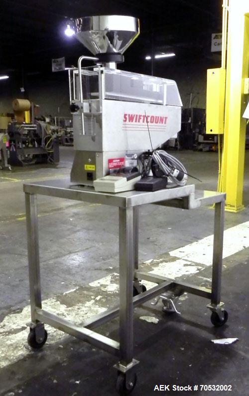 Used SwiftPack Model SwiftCount Electronic Tablet Counter. Designed to feed and count any size shape or quantity of tablets without change parts, in batches of 2-9999. Incorporates a similar micropro...