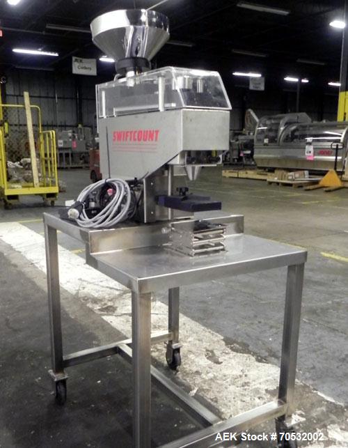 Used SwiftPack Model SwiftCount Electronic Tablet Counter. Designed to feed and count any size shape or quantity of tablets without change parts, in batches of 2-9999. Incorporates a similar micropro...
