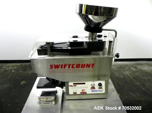 Used SwiftPack Model SwiftCount Electronic Tablet Counter. Designed to feed and count any size shape or quantity of tablets without change parts, in batches of 2-9999. Incorporates a similar micropro...