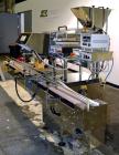 Used King Model TC8 Electronic Tablet Counter. Capable of speeds up to 60 bottles per minute depending on count and container size. Has two trays with 8 channels, pin indexing system and conveyor. Du...
