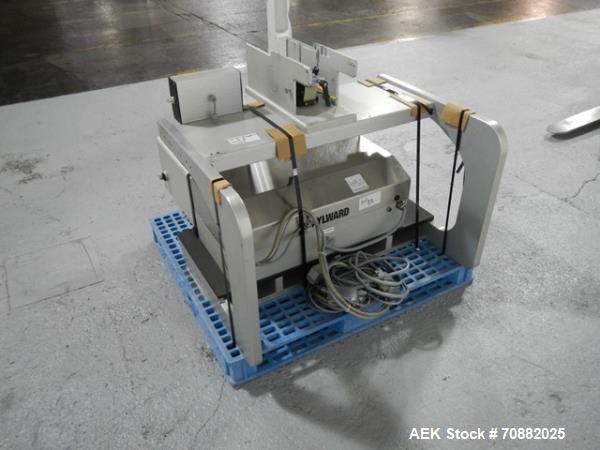 Used Aylward Capsule Feeder Station 