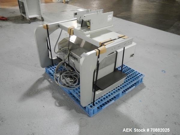 Used Aylward Capsule Feeder Station 