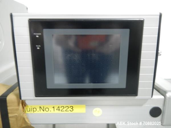 Used Aylward Capsule Feeder Station 