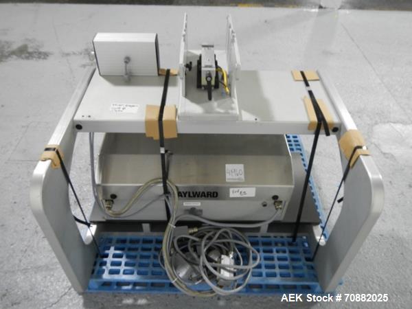Used Aylward Capsule Feeder Station 