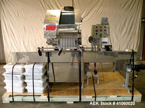 Used King SC6L Tablet or Capsule Slat Counter capable of speeds up to 120 bottles per minute. Has pin indexing with 4" wide x 114" long table top chain indexing conveyor. Tablet size range: 3 - 25mm....