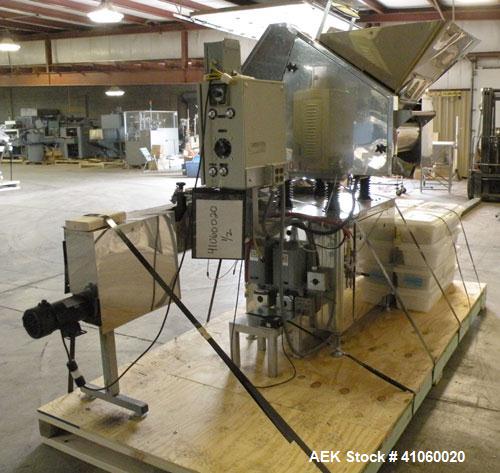 Used King SC6L Tablet or Capsule Slat Counter capable of speeds up to 120 bottles per minute. Has pin indexing with 4" wide x 114" long table top chain indexing conveyor. Tablet size range: 3 - 25mm....