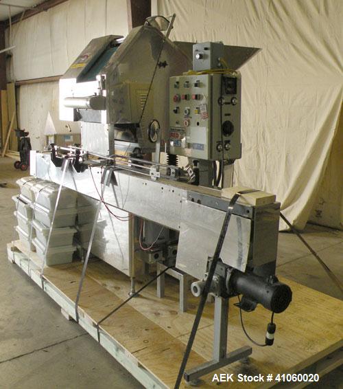 Used King SC6L Tablet or Capsule Slat Counter capable of speeds up to 120 bottles per minute. Has pin indexing with 4" wide x 114" long table top chain indexing conveyor. Tablet size range: 3 - 25mm....