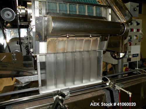 Used King SC6L Tablet or Capsule Slat Counter capable of speeds up to 120 bottles per minute. Has pin indexing with 4" wide x 114" long table top chain indexing conveyor. Tablet size range: 3 - 25mm....