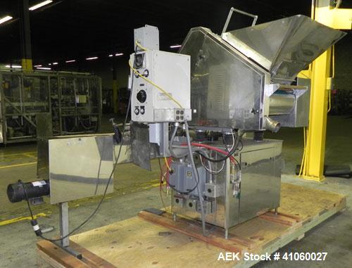 Used King SC6L Tablet or Capsule Slat Counter. Capable of speeds up to 120 bottles per minute. Has pin indexing with 4" wide x 114" long table top chain indexing conveyor. Tablet size range: 3 - 25 m...