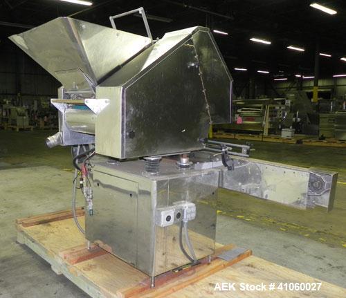 Used King SC6L Tablet or Capsule Slat Counter. Capable of speeds up to 120 bottles per minute. Has pin indexing with 4" wide x 114" long table top chain indexing conveyor. Tablet size range: 3 - 25 m...