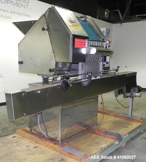 Used King SC6L Tablet or Capsule Slat Counter. Capable of speeds up to 120 bottles per minute. Has pin indexing with 4" wide x 114" long table top chain indexing conveyor. Tablet size range: 3 - 25 m...