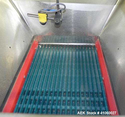 Used King SC6L Tablet or Capsule Slat Counter. Capable of speeds up to 120 bottles per minute. Has pin indexing with 4" wide x 114" long table top chain indexing conveyor. Tablet size range: 3 - 25 m...