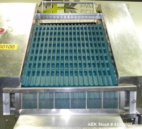Used King SC6L Tablet or Capsule Slat Counter. Capable of speeds up to 120 bottles per minute. Has pin indexing with 4" wide x 114" long table top chain indexing conveyor. Tablet size range: 3 - 25 m...