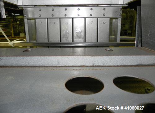 Used King SC6L Tablet or Capsule Slat Counter. Capable of speeds up to 120 bottles per minute. Has pin indexing with 4" wide x 114" long table top chain indexing conveyor. Tablet size range: 3 - 25 m...