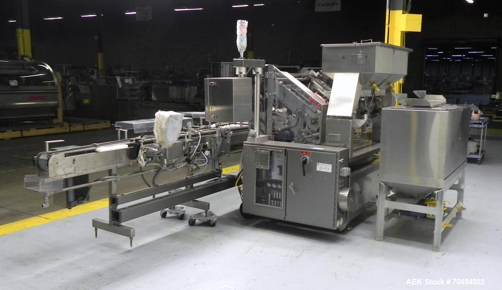 Used Lakso 990 (Model 93) Slat Counter. Is a dual lane unit with dual wormscrew infeed and gating device. Machine is capable of speeds over 300 bottles per minute. Has Lakso "Micro-Scan" empty cavity...