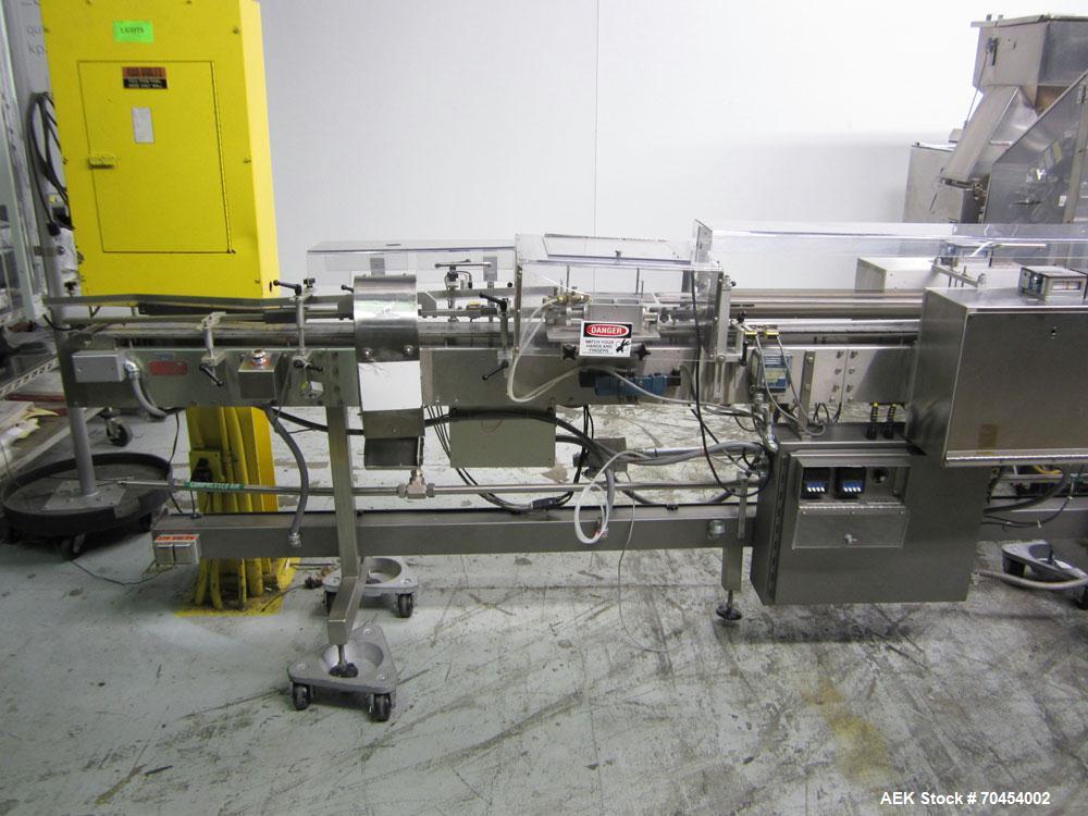 Used Lakso 990 (Model 93) Slat Counter. Is a dual lane unit with dual wormscrew infeed and gating device. Machine is capable of speeds over 300 bottles per minute. Has Lakso "Micro-Scan" empty cavity...