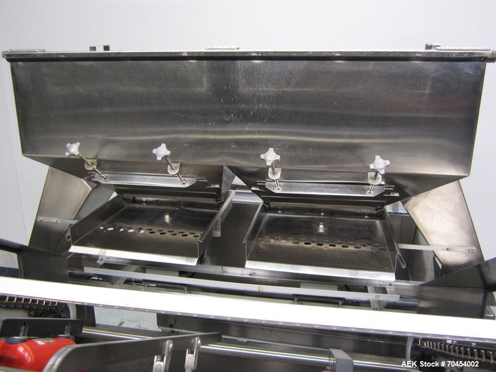 Used Lakso 990 (Model 93) Slat Counter. Is a dual lane unit with dual wormscrew infeed and gating device. Machine is capable of speeds over 300 bottles per minute. Has Lakso "Micro-Scan" empty cavity...