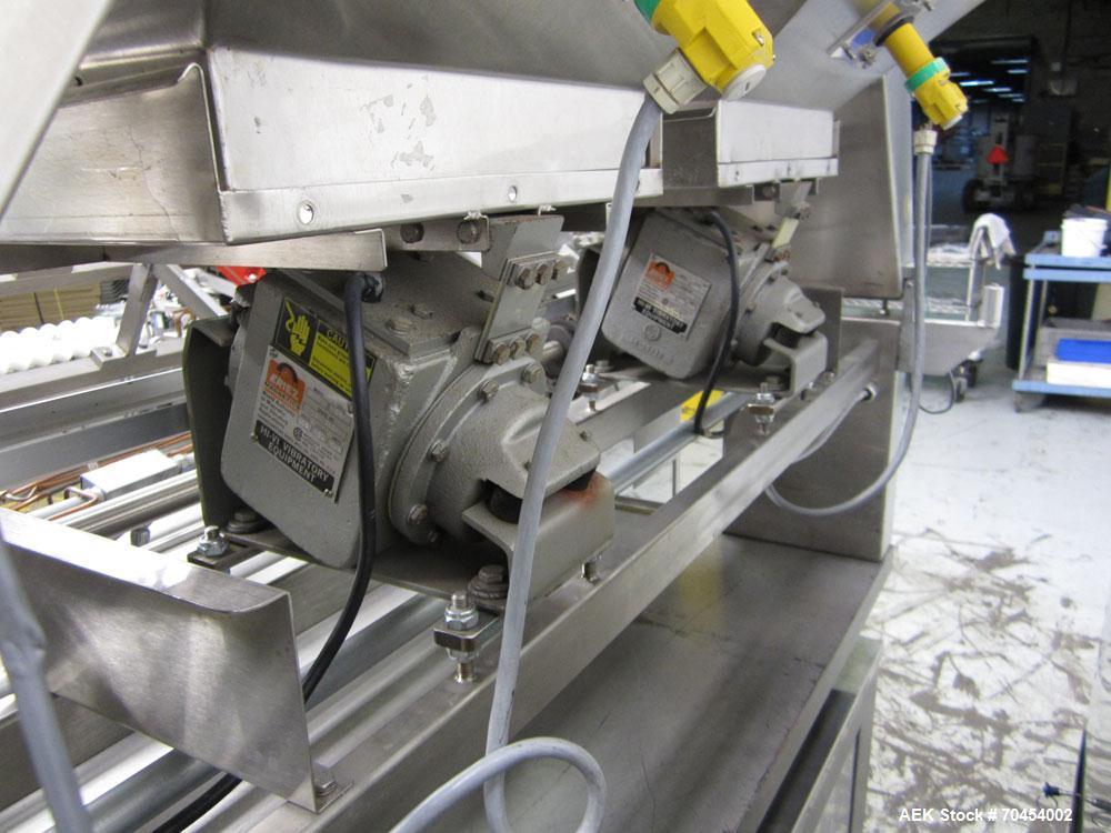 Used Lakso 990 (Model 93) Slat Counter. Is a dual lane unit with dual wormscrew infeed and gating device. Machine is capable of speeds over 300 bottles per minute. Has Lakso "Micro-Scan" empty cavity...