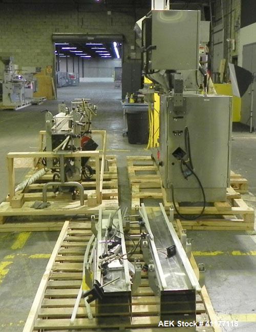 Used Merrill Model 40-39ADH Dual Lane Slat Counter. Machine is rated at up to 300 (100-count bottles per minute). Machine is all stainless steel. Allen Bradley PLC controls. Dual lane screw feed syst...