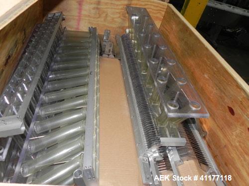 Used Merrill Model 40-39ADH Dual Lane Slat Counter. Machine is rated at up to 300 (100-count bottles per minute). Machine is all stainless steel. Allen Bradley PLC controls. Dual lane screw feed syst...