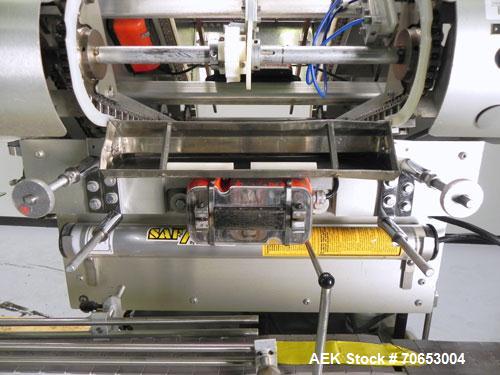 Used Merrill-Pennwalt (IMA) Model 72-16A Slat Counter capable of speeds up to 150 containers per minute. Has pin indexing system with Garvey table top indexing conveyor. Has stand alone stainless ste...