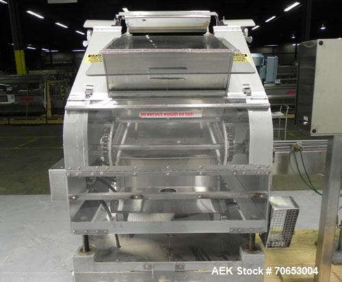 Used Merrill-Pennwalt (IMA) Model 72-16A Slat Counter capable of speeds up to 150 containers per minute. Has pin indexing system with Garvey table top indexing conveyor. Has stand alone stainless ste...