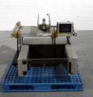 Used Aylward Capsule Feeder Station 
