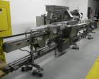 Used Lakso 990 (Model 93) Slat Counter. Is a dual lane unit with dual wormscrew infeed and gating device. Machine is capable of speeds over 300 bottles per minute. Has Lakso 