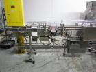 Used Lakso 990 (Model 93) Slat Counter. Is a dual lane unit with dual wormscrew infeed and gating device. Machine is capable of speeds over 300 bottles per minute. Has Lakso 