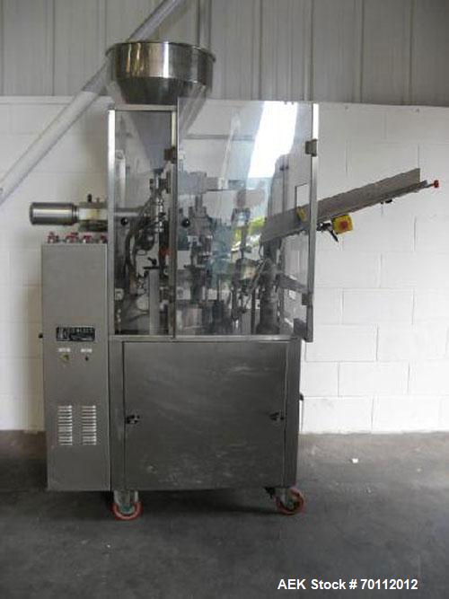 Used Comadis C-125 Plastic and Metal Tube Filler, rotary valve piston tube filler