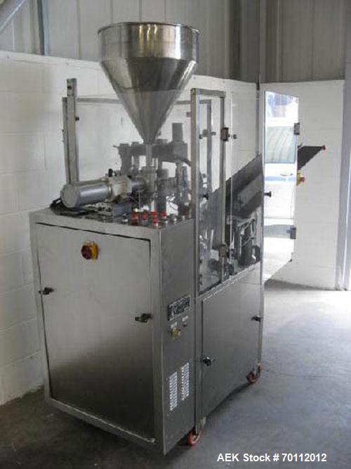 Used Comadis C-125 Plastic and Metal Tube Filler, rotary valve piston tube filler