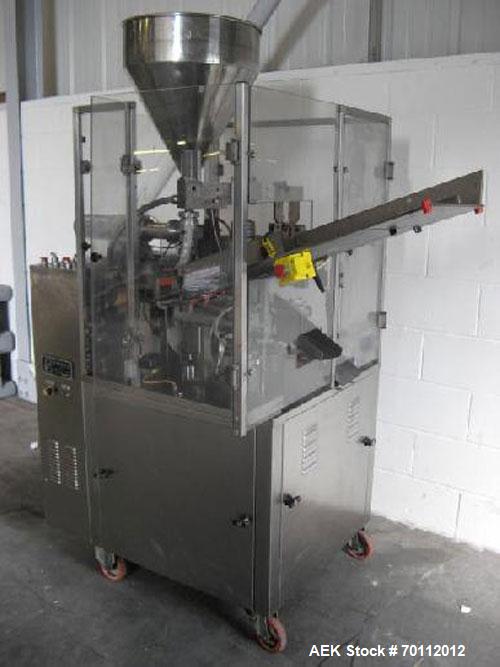 Used Comadis C-125 Plastic and Metal Tube Filler, rotary valve piston tube filler