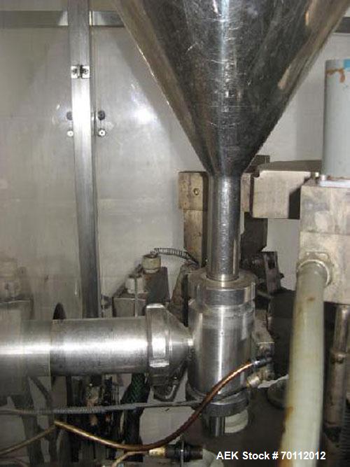 Used Comadis C-125 Plastic and Metal Tube Filler, rotary valve piston tube filler