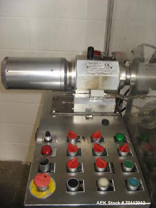 Used Comadis C-125 Plastic and Metal Tube Filler, rotary valve piston tube filler