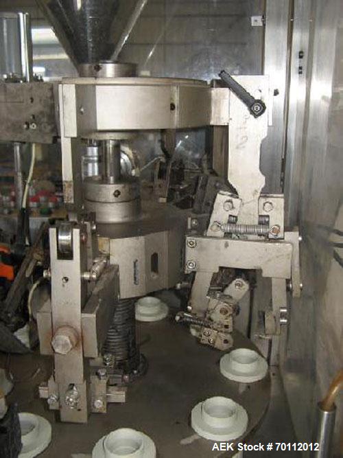 Used Comadis C-125 Plastic and Metal Tube Filler, rotary valve piston tube filler