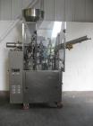 Used Comadis C-125 Plastic and Metal Tube Filler, rotary valve piston tube filler