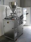 Used Comadis C-125 Plastic and Metal Tube Filler, rotary valve piston tube filler
