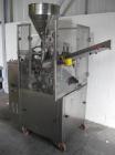 Used Comadis C-125 Plastic and Metal Tube Filler, rotary valve piston tube filler