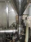 Used Comadis C-125 Plastic and Metal Tube Filler, rotary valve piston tube filler