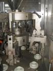 Used Comadis C-125 Plastic and Metal Tube Filler, rotary valve piston tube filler