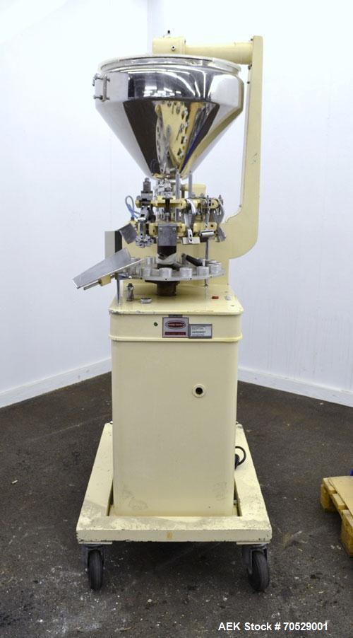 Used Kalix Automatic Metal Tube Filling Machine, Model KX-60. Capacity up to 50 tubes per minute. Maximum tube dimensions: 1-1/2" or 40mm diameter x 7" or 200mm height. Filling range: 2cc to 162cc wi...