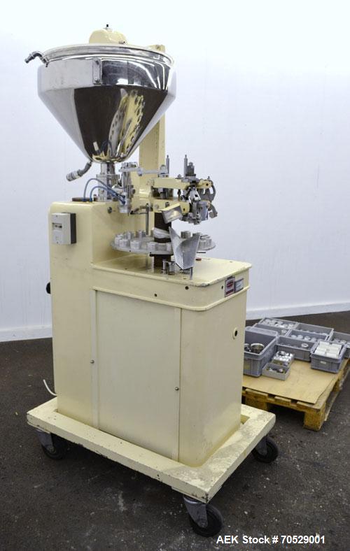 Used Kalix Automatic Metal Tube Filling Machine, Model KX-60. Capacity up to 50 tubes per minute. Maximum tube dimensions: 1-1/2" or 40mm diameter x 7" or 200mm height. Filling range: 2cc to 162cc wi...