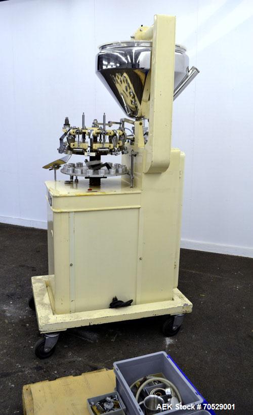 Used Kalix Automatic Metal Tube Filling Machine, Model KX-60. Capacity up to 50 tubes per minute. Maximum tube dimensions: 1-1/2" or 40mm diameter x 7" or 200mm height. Filling range: 2cc to 162cc wi...